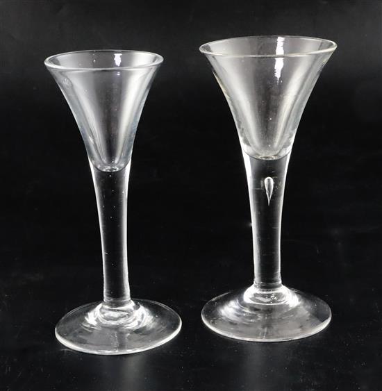 Two drawn trumpet wine glasses, c.1750, H. 16.7 and 16.3cm